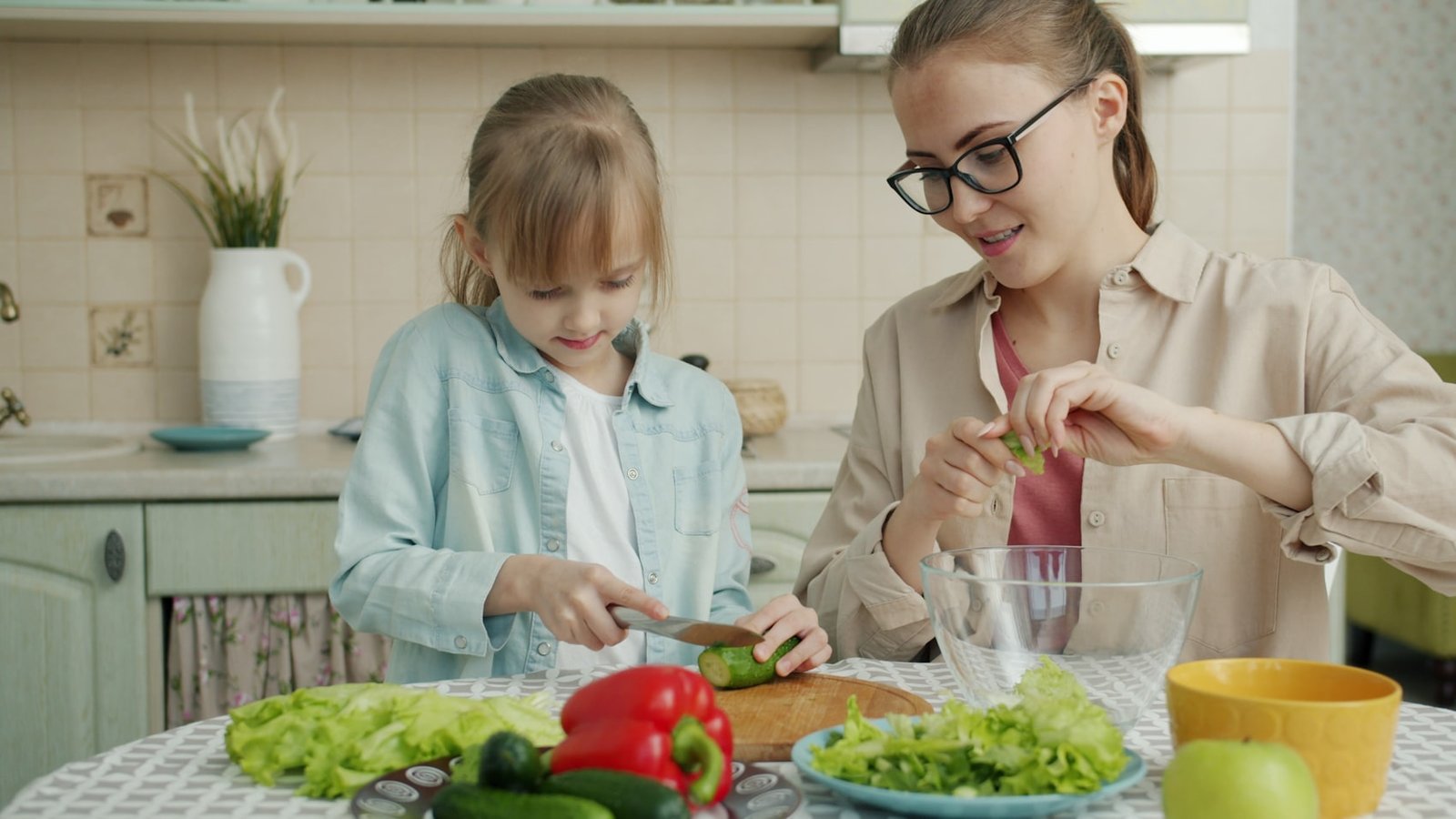 A parent and child in a kitchen
